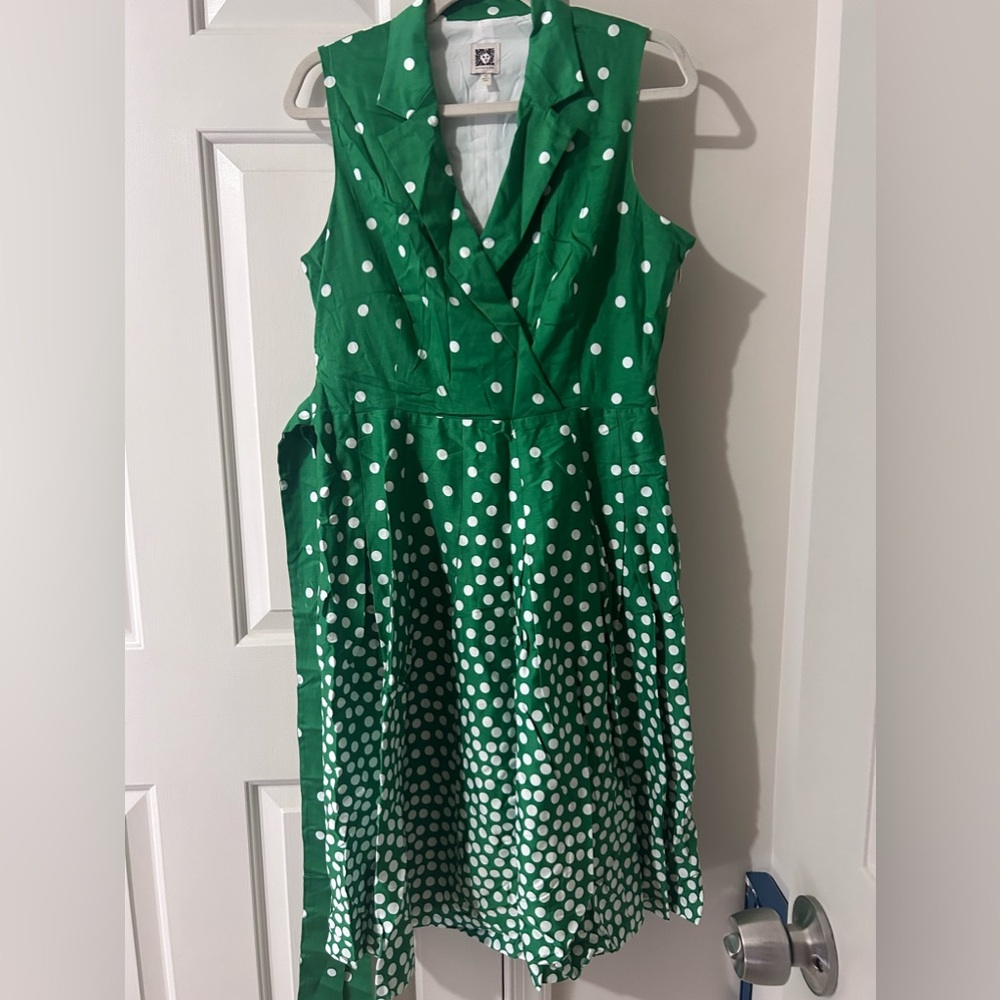Kelly green polkadot dress. Side zipper and side attached belt. Great condition.